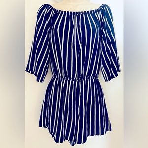 This Navy Short (s) Romper with white pinstripe in a small…no tags but like new.
